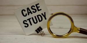 image shown Case study sign with magnifying glass on wooden table